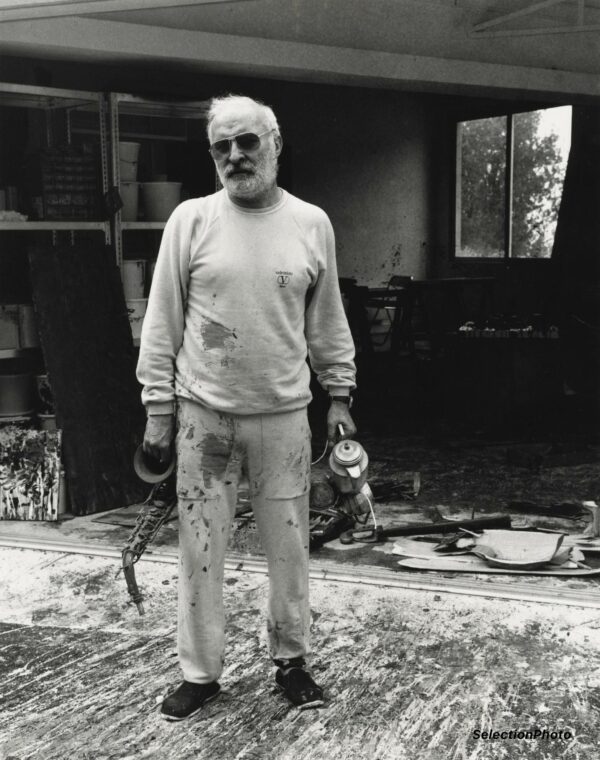 ARMAN in his workshop c1985 - Photograph P. BONAN - Vintage Print 13.8xx11in